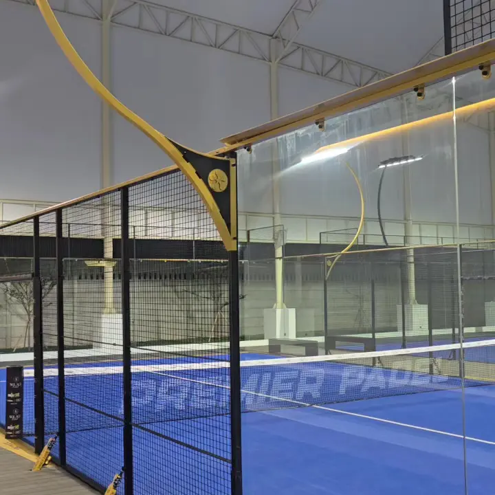 Blue Premier Padel court behind panoramic glass